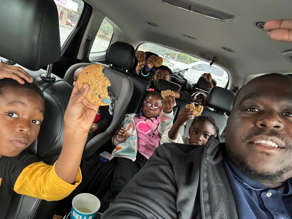 Jessie Cave sharing cookies with kids in a car